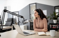 gallery/woman-radio-studio-with-microphone-coffee_23-2148808777